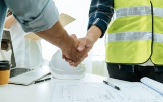 hand shake for Sidewalk snow clearing services Calgary