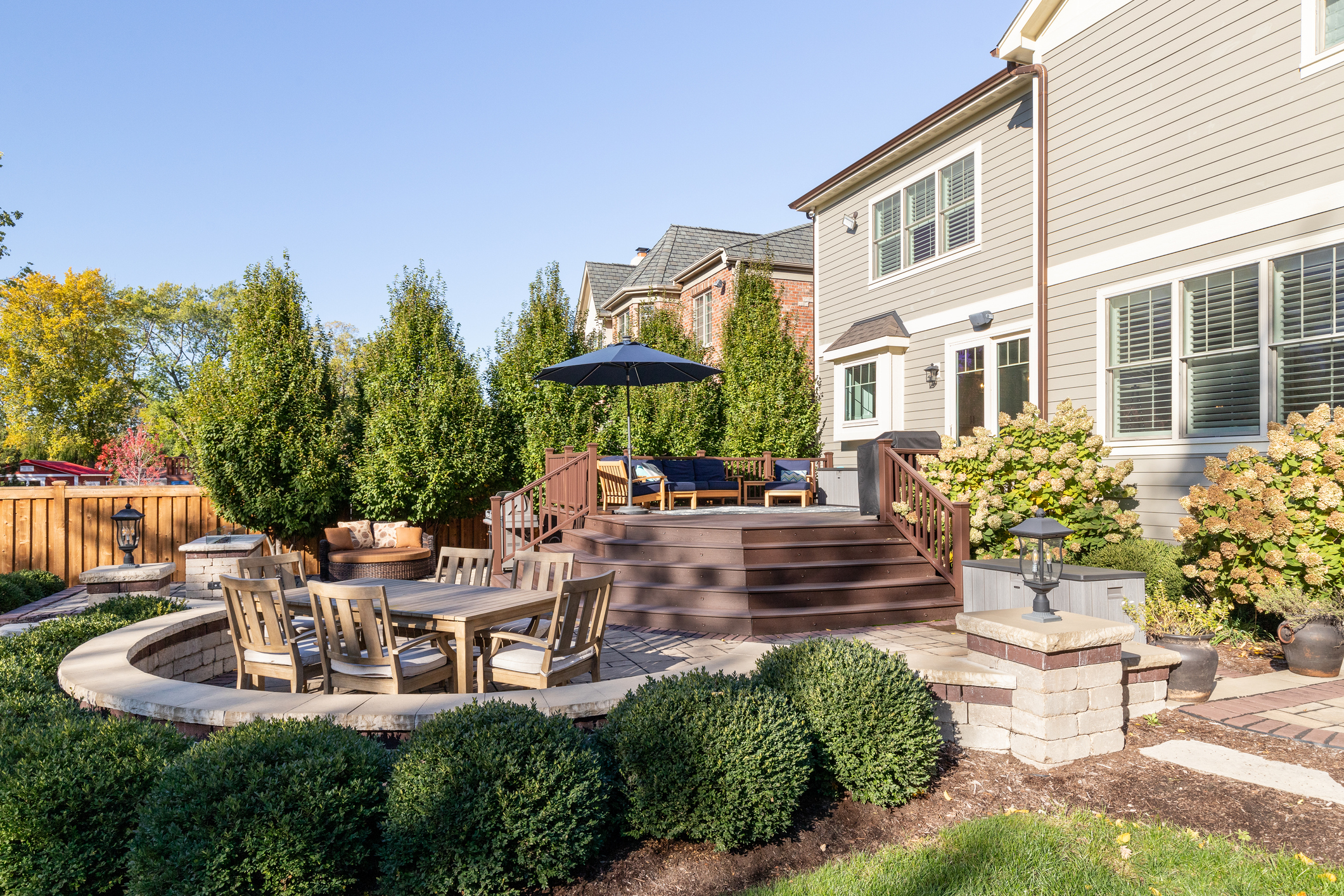 a luxury backyard brick patio.